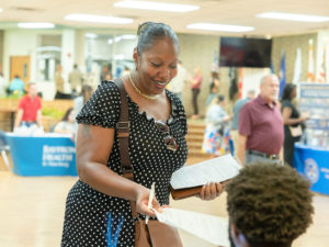 A woman applying for a job at our Anchors career fair