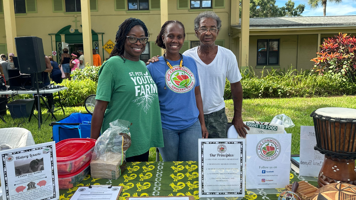 One Community Grocery Co-Op leaders at an event