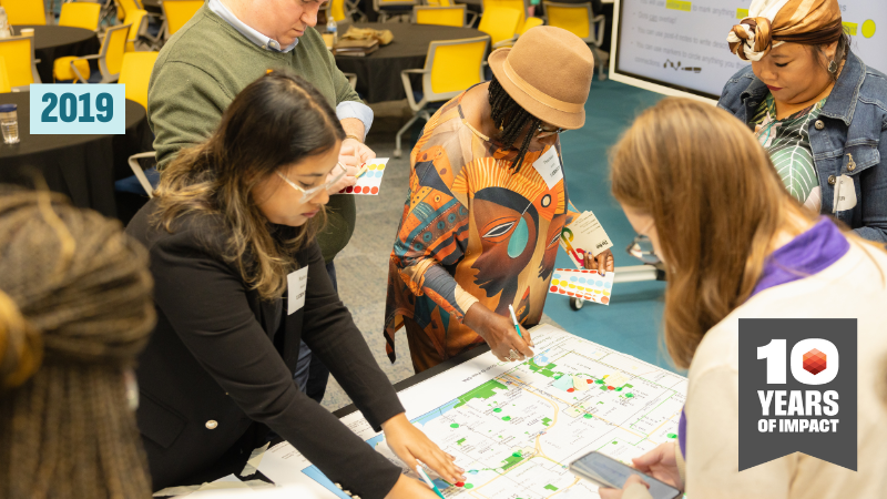 image of participatory research with 10-year symbol